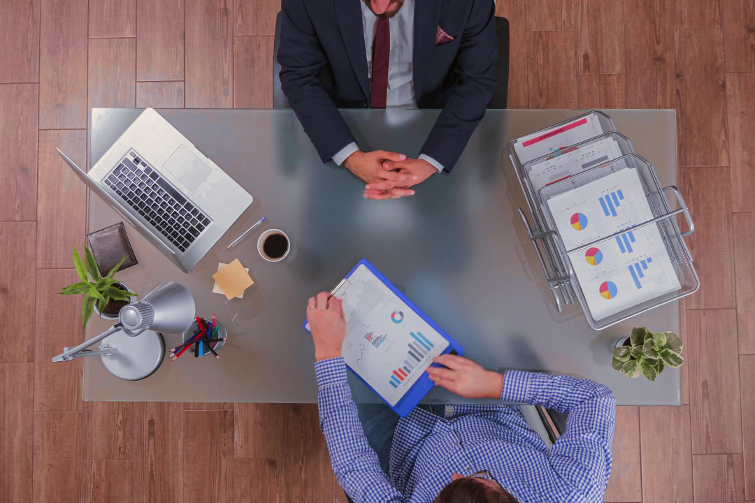 top-view-businessman-analyzing-financial-documents-discussing-company-strategy
